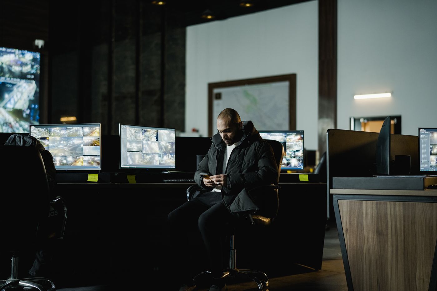 CCTV footage monitored on screens and checked remotely on a phone