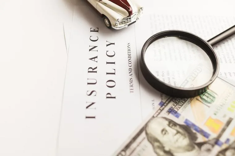 Cyber insurance policy document being reviewed before renewal