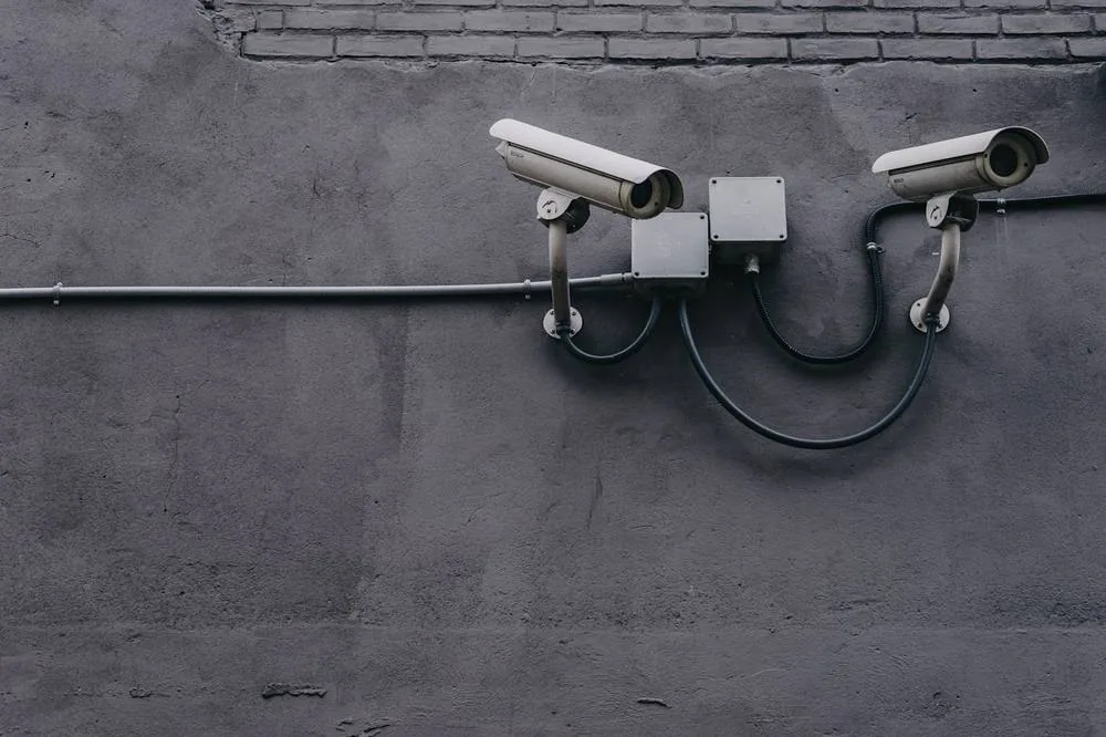 Office door controller and CCTV on a concrete wall