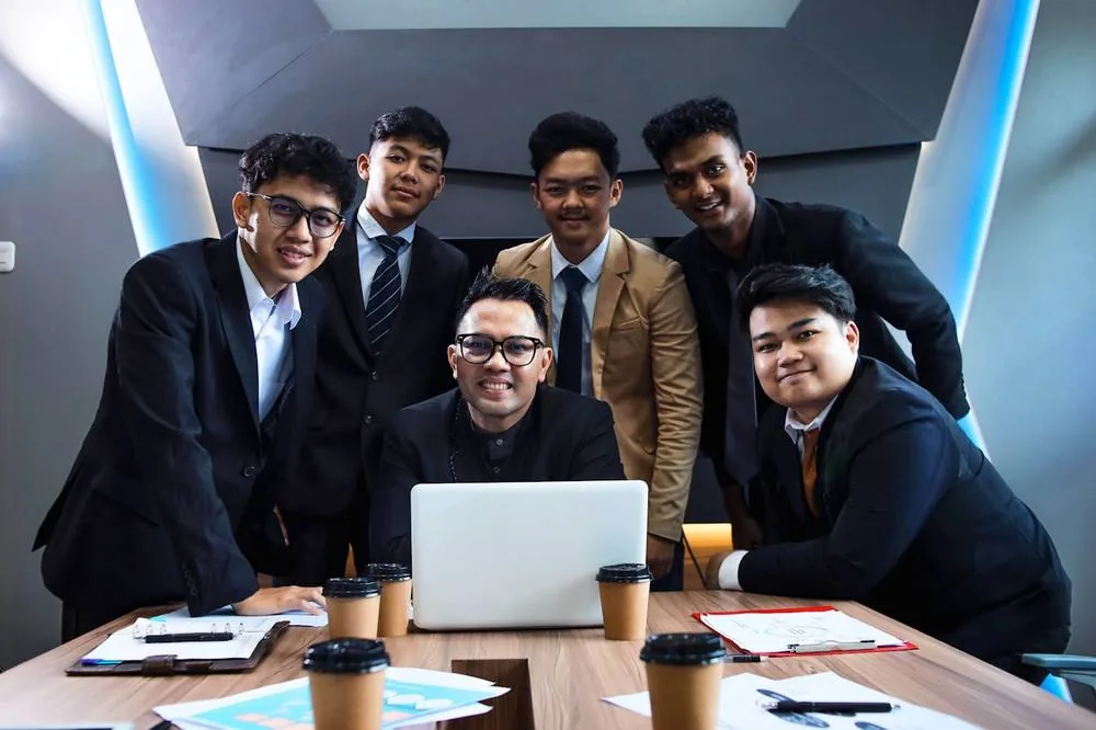A Singapore team reviewing the weekly IT report